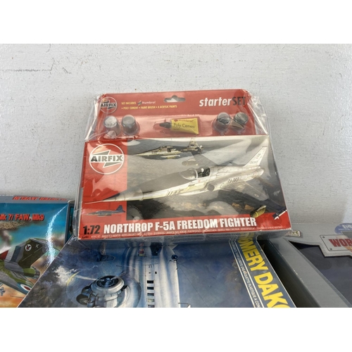 487 - A collection of model kits to include Airfix, Plastyk, Rodan etc. together with a boxed Air Legends ... 