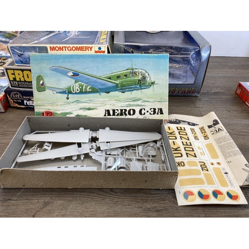 487 - A collection of model kits to include Airfix, Plastyk, Rodan etc. together with a boxed Air Legends ... 