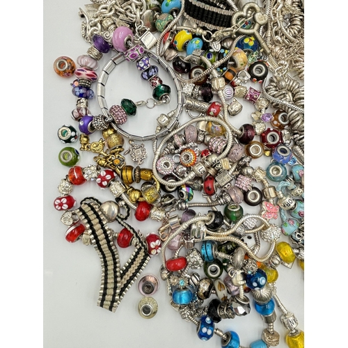 2131 - A collection of fashion charm bracelets and charms