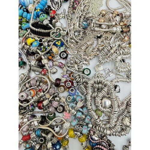 2131 - A collection of fashion charm bracelets and charms