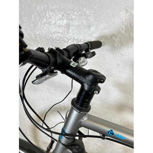 1021 - A Kona Dew men's bike together with a bd Bikes Turbo Trainer