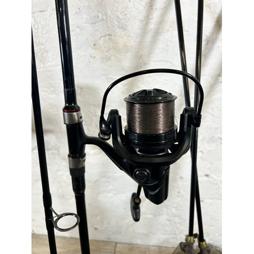 1009 - Five fishing items, Three Greys X-Flite 12' fishing rods with Daiwa Emblem 35 fishing reels, one Tra... 