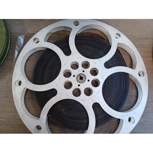 643 - A collection of cine reels to include cannisters marked 9.5mm silent 'Conquest of Sicily', 'Covered ... 