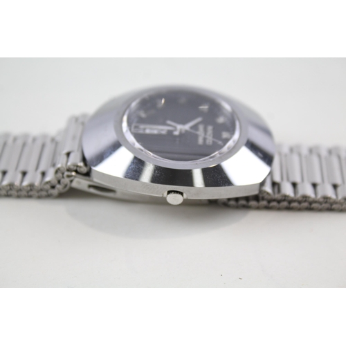 2177 - A Rado Diastar day/date quartz men's wristwatch with spare links and card holder - ref no. 114.0305.... 