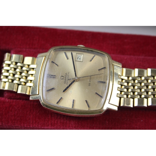 2186 - A 1970s boxed Omega De Ville gold plated automatic men's wristwatch