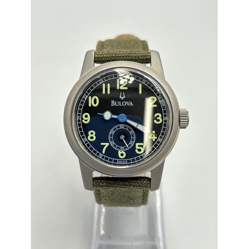 2180 - A boxed Bulova military style quartz men's wristwatch - ref no. C860736C