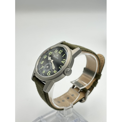 2180 - A boxed Bulova military style quartz men's wristwatch - ref no. C860736C