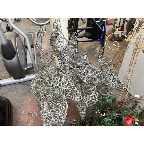 1034C - A collection of Christmas items to include light up reindeer, decorative basket etc.