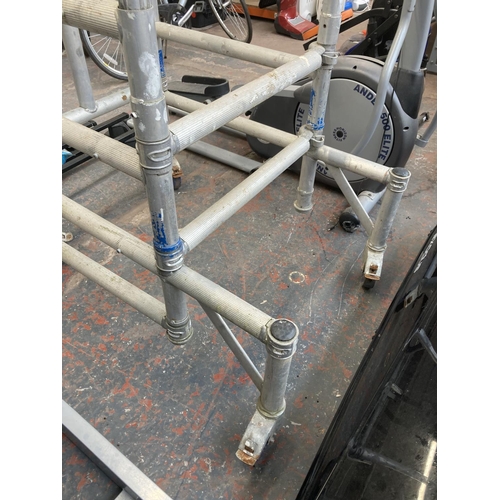 1035 - A portable scaffolding frame on castors