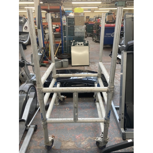 1035 - A portable scaffolding frame on castors