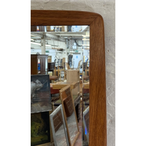 248 - A mid 20th century teak framed bevelled edge wall mirror - approx. 92cm high x 36cm wide