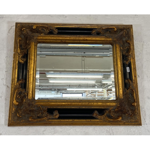 250 - A 19th century style black and gilt framed bevelled edge wall mirror - approx. 51cm high x 60cm wide