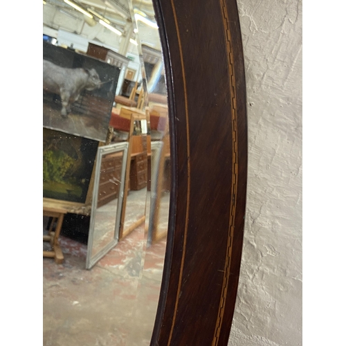 260 - An Edwardian inlaid mahogany framed bevelled edge oval wall mirror - approx. 92cm high x 60cm wide