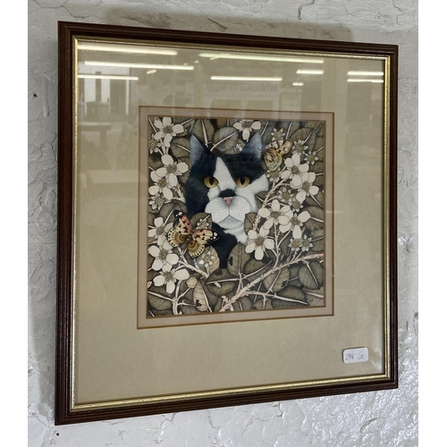 262 - A late 20th century framed Helen Mortley watercolour of a cat in foliage initialled lower right  - a... 