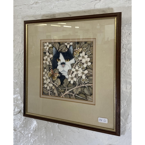 262 - A late 20th century framed Helen Mortley watercolour of a cat in foliage initialled lower right  - a... 