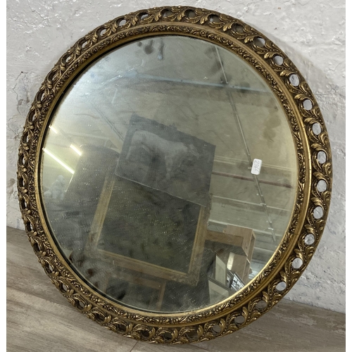 272 - A mid 20th century gilt framed circular wall mirror - approx. 60cm diameter