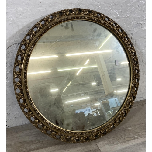 272 - A mid 20th century gilt framed circular wall mirror - approx. 60cm diameter