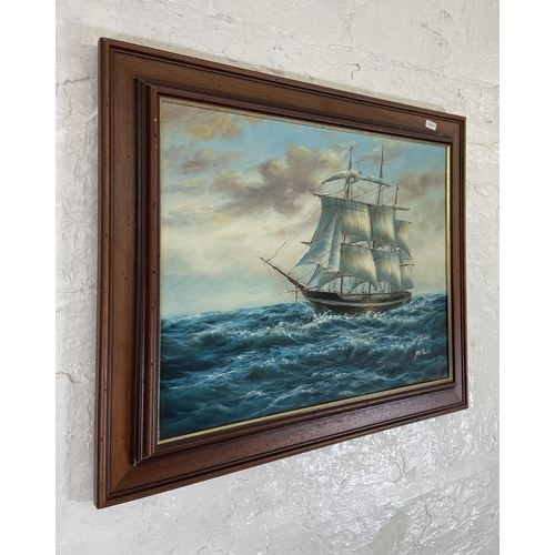 273 - A late 20th century framed oil on canvas of a Clipper ship at sea signed lower right - approx. 53cm ... 