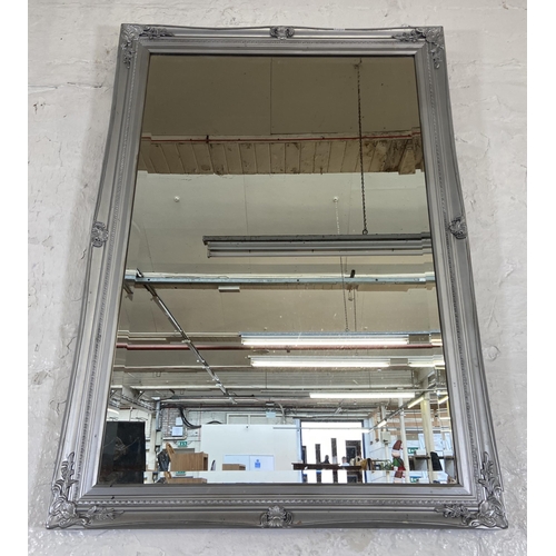 275 - A modern grey painted bevelled edge wall mirror - approx. 103cm high x 73cm wide