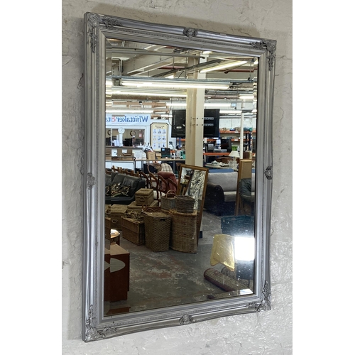 275 - A modern grey painted bevelled edge wall mirror - approx. 103cm high x 73cm wide