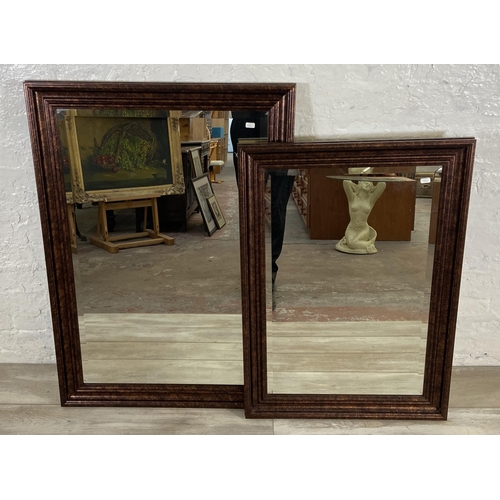 281 - Two modern bevelled edge wall mirrors - largest approx. 105cm high x 74cm wide