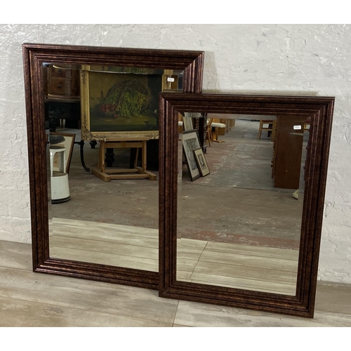 281 - Two modern bevelled edge wall mirrors - largest approx. 105cm high x 74cm wide