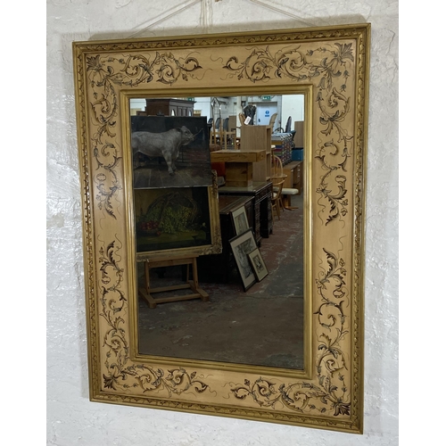 282 - A modern hand painted floral decorated gilt framed wall mirror - approx. 120cm high x 98cm wide