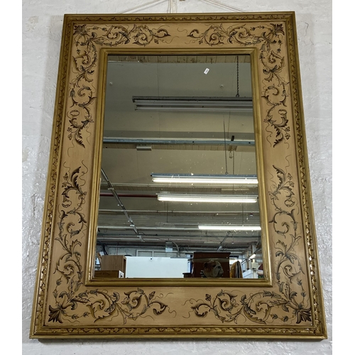 282 - A modern hand painted floral decorated gilt framed wall mirror - approx. 120cm high x 98cm wide