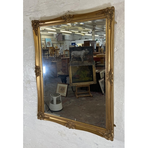 285 - A 19th century style gilt framed bevelled edge wall mirror - approx. 87cm high x 112cm wide