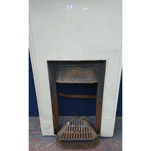 102 - A Victorian style cast iron fire surround - approx. 132cm high x 99cm wide x 18cm deep