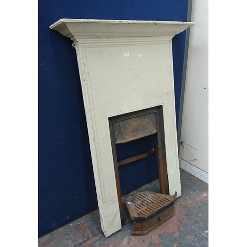 102 - A Victorian style cast iron fire surround - approx. 132cm high x 99cm wide x 18cm deep