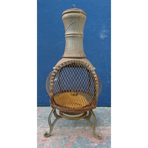 104 - A cast metal garden chiminea - approx. 90cm high