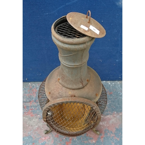 104 - A cast metal garden chiminea - approx. 90cm high