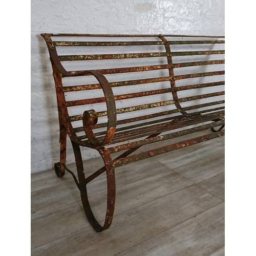 104A - A 19th century wrought iron strap work garden bench - approx. 82cm high x 150cm wide x 70cm deep