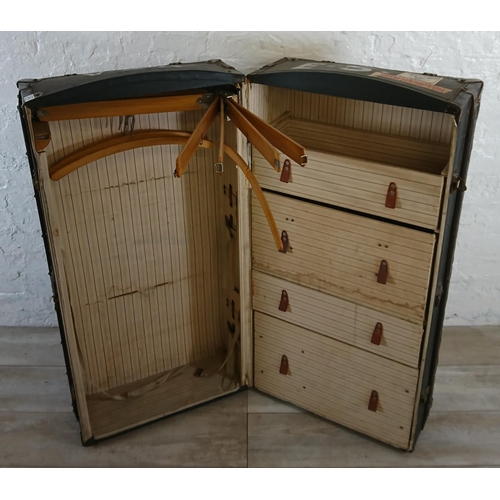 108 - An early 20th century blue painted fibreboard and wooden banded travel trunk with fitted interior