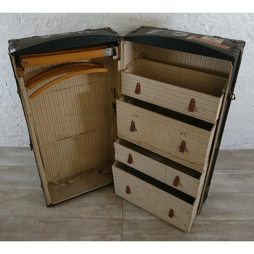 108 - An early 20th century blue painted fibreboard and wooden banded travel trunk with fitted interior