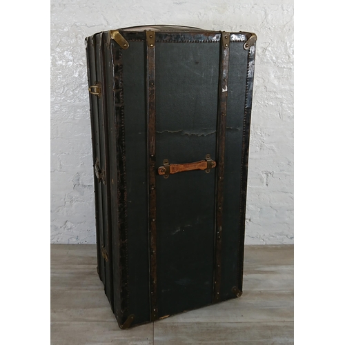 108 - An early 20th century blue painted fibreboard and wooden banded travel trunk with fitted interior