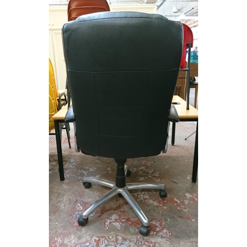 110 - A black leather adjustable swivel desk chair - approx. 117cm high x 67cm wide