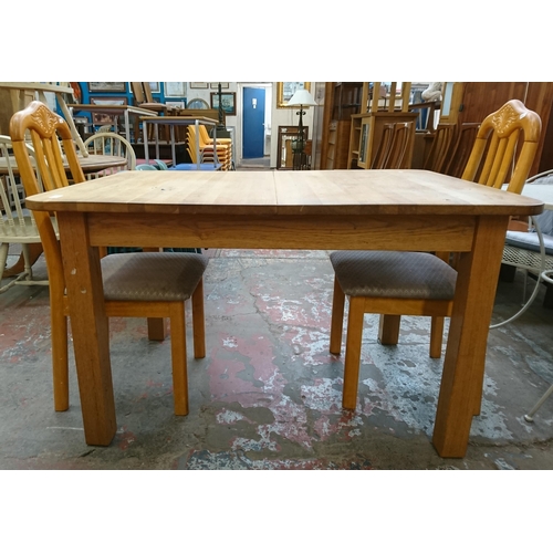 113 - Five pieces of furniture, one oak extending dining table and four beech framed dining chairs