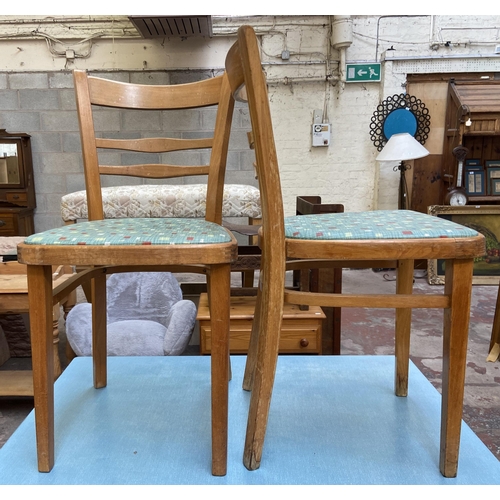 117 - A 1950s blue laminate and beech rectangular kitchen table and two chairs - table approx. 76cm high x... 