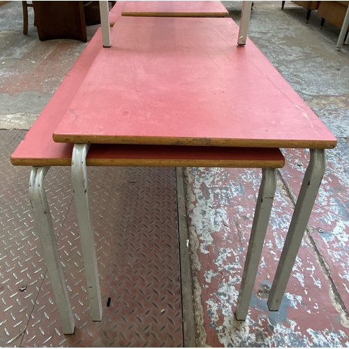 120 - Five mid 20th century red laminate and tubular metal school desks - each approx. 55cm high x 110cm l... 