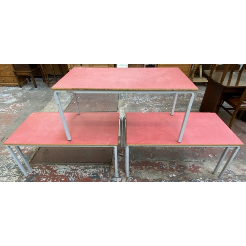 120 - Five mid 20th century red laminate and tubular metal school desks - each approx. 55cm high x 110cm l... 