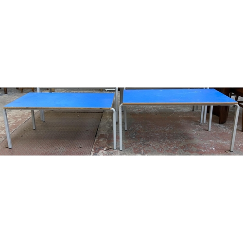 121 - Four mid 20th century laminate and tubular metal school desks