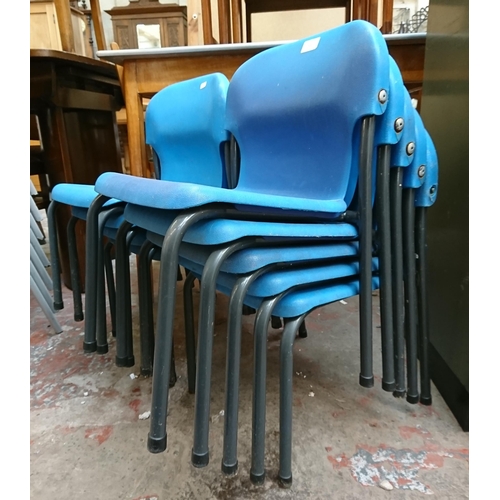 122 - Nine mid/late 20th century blue plastic and tubular metal stacking children's school chairs