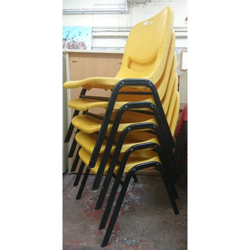 126 - Fourteen mid/late 20th century Scholar yellow plastic and tubular metal stacking children’s school c... 