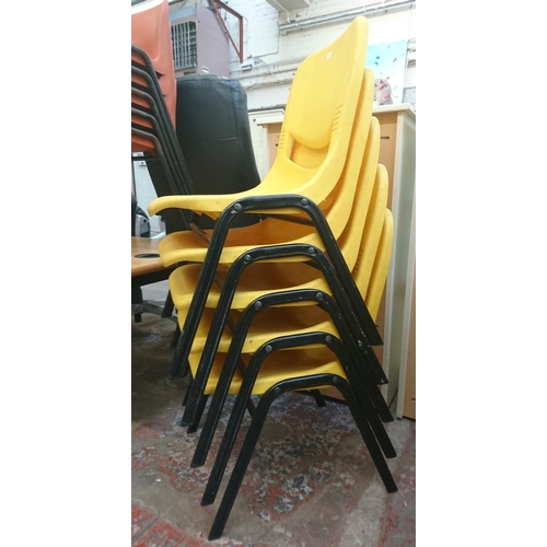 126 - Fourteen mid/late 20th century Scholar yellow plastic and tubular metal stacking children’s school c... 