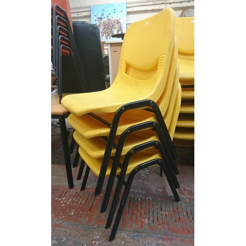 126 - Fourteen mid/late 20th century Scholar yellow plastic and tubular metal stacking children’s school c... 