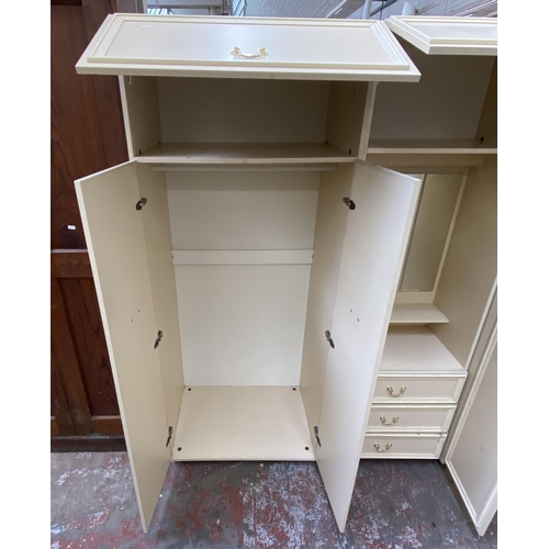 130 - A 1980s white laminate triple wardrobe - approx. 182cm high x 210cm wide x 55cm deep