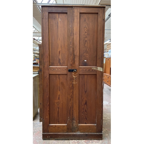 131 - An antique pitch pine school cupboard - approx. 198cm high x 91cm wide x 45cm deep