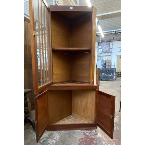 132 - A mahogany free standing corner display cabinet - approx. 186cm high